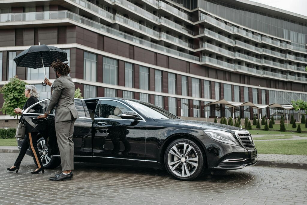Luxury Chauffeur services Melbourne with personal chauffeur opening the door