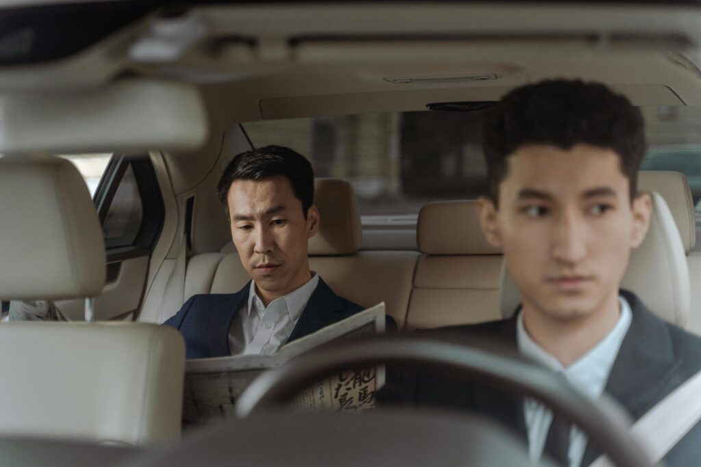 Luxury chauffeur service Melbourne with driver opening the door for passenger